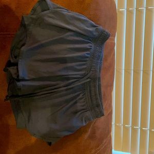 Athletic shorts with connected bottom shorts